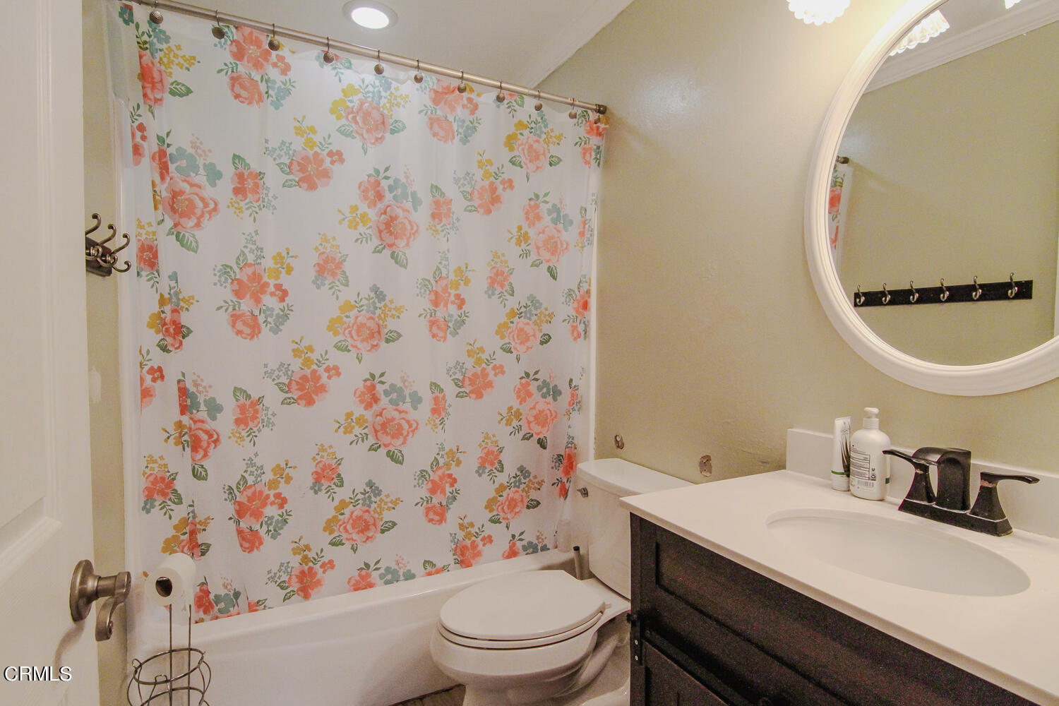 19230 Hamlin Street, Unit 1 Reseda, CA 91335 - Photo 12 of 17 a bathroom with a sink toilet and a mirror