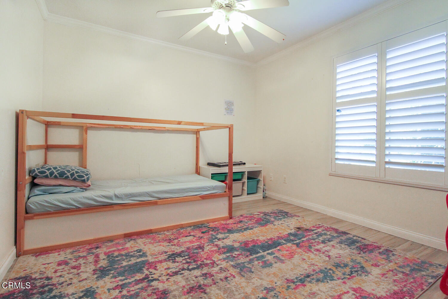 19230 Hamlin Street, Unit 1 Reseda, CA 91335 - Photo 13 of 17 a bedroom with a bed and a window