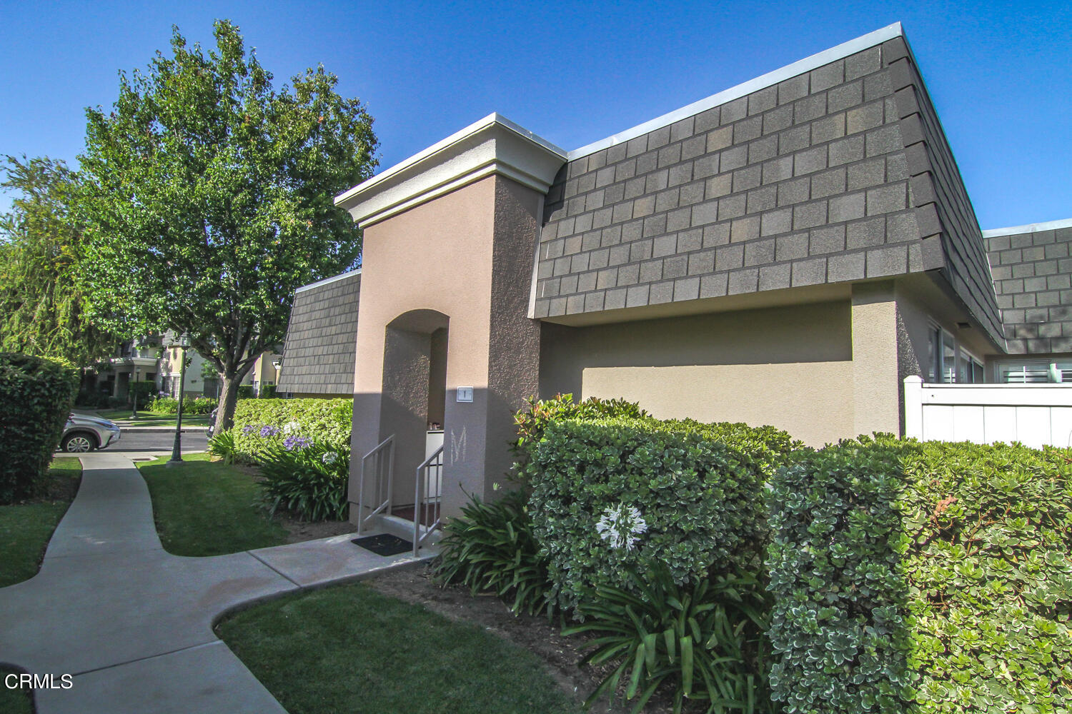 19230 Hamlin Street, Unit 1 Reseda, CA 91335 - Photo 17 of 17 a front view of a house with garden