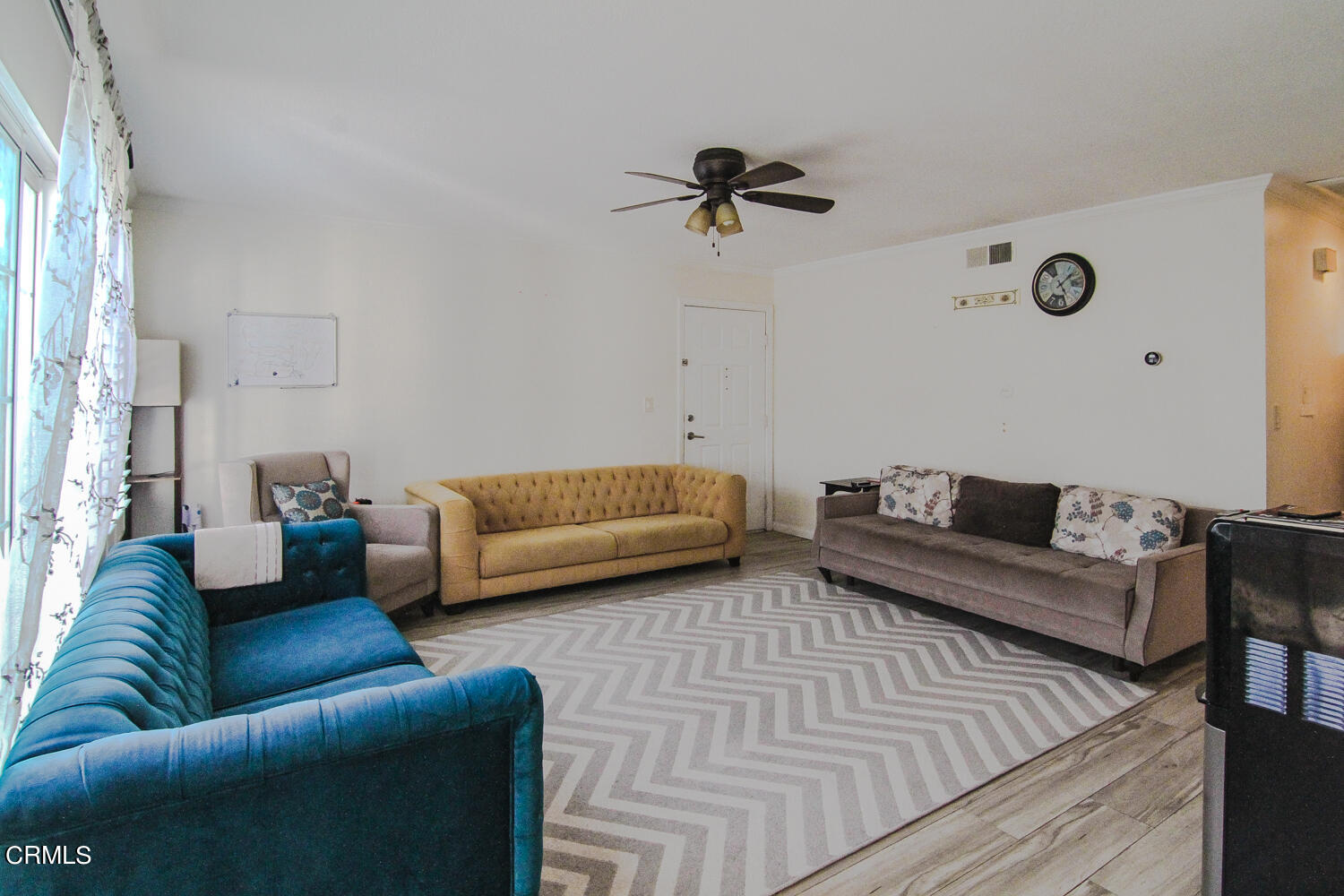 19230 Hamlin Street, Unit 1 Reseda, CA 91335 - Photo 4 of 17 a living room with furniture and a wooden floor