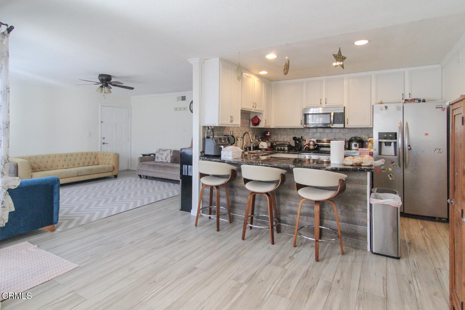 19230 Hamlin Street, Unit 1 Reseda, CA 91335 - Photo 5 of 17 a large kitchen with a table and chairs