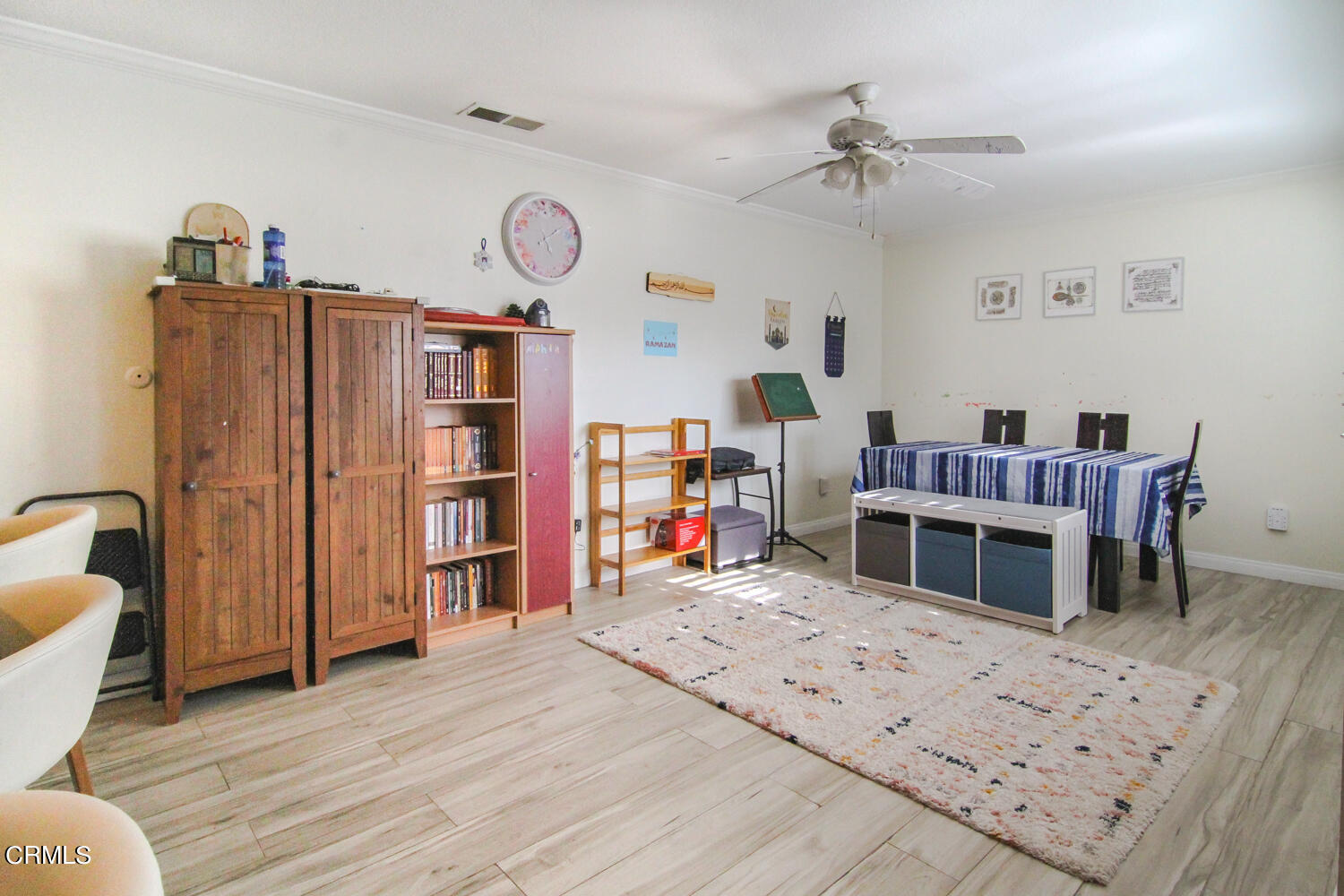 19230 Hamlin Street, Unit 1 Reseda, CA 91335 - Photo 8 of 17 a living room with furniture a fireplace and a flat screen tv