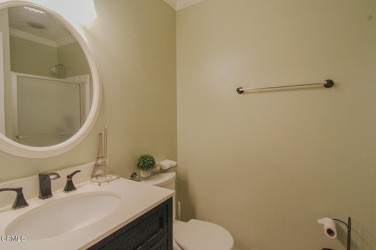 19230 Hamlin Street, Unit 1 Reseda, CA 91335 - Photo 9 of 17 a bathroom with a sink toilet and mirror