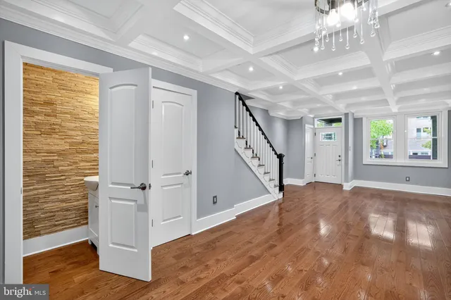 a view of an entryway with wooden floor