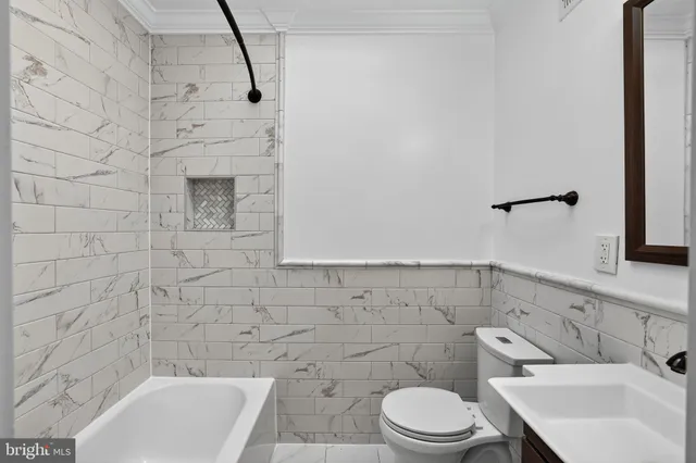 a bathroom with a toilet and sink