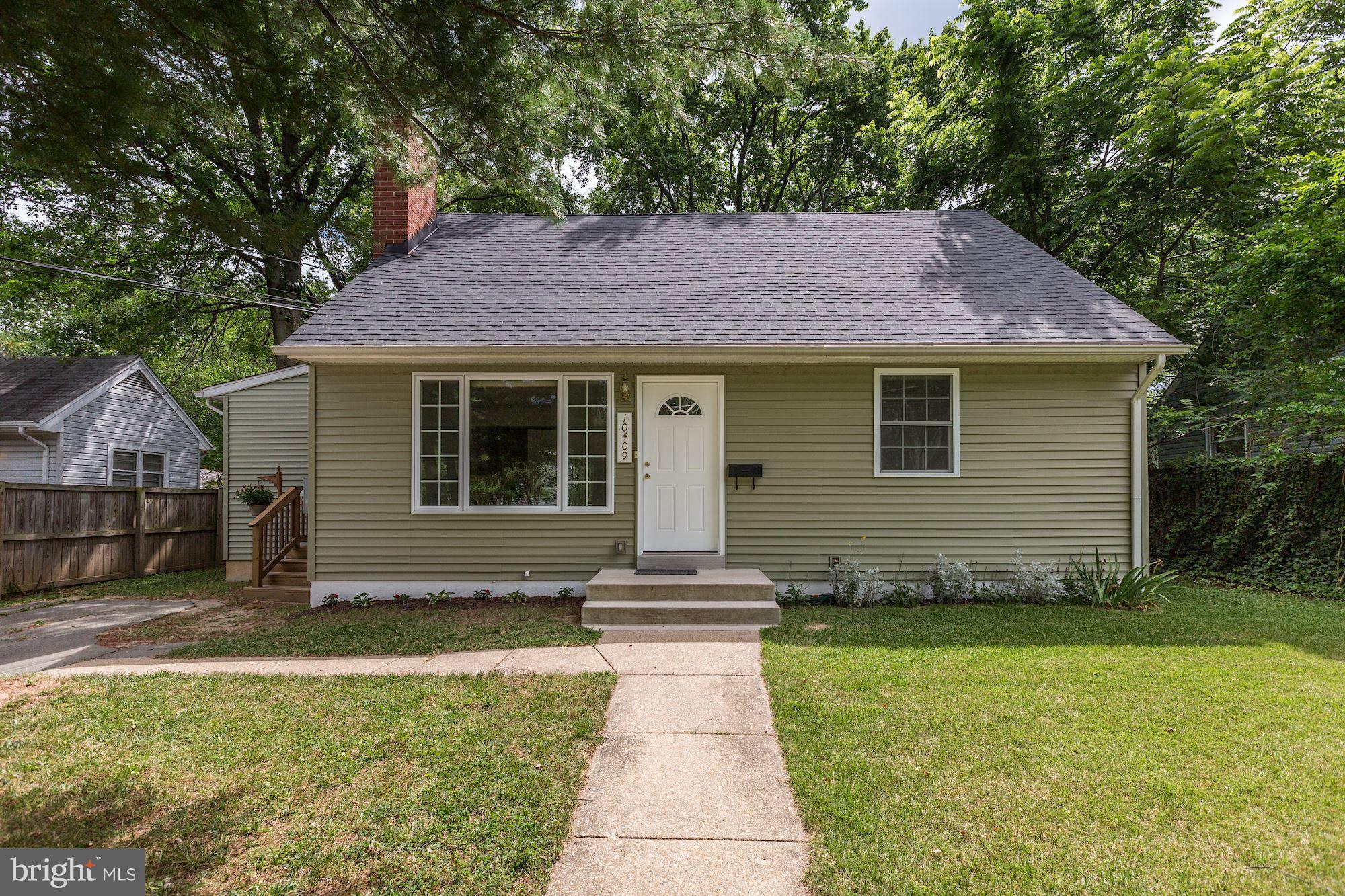 10409 Procter Street Silver Spring, MD 20901 - Photo 1 of 30 a front view of a house with a garden