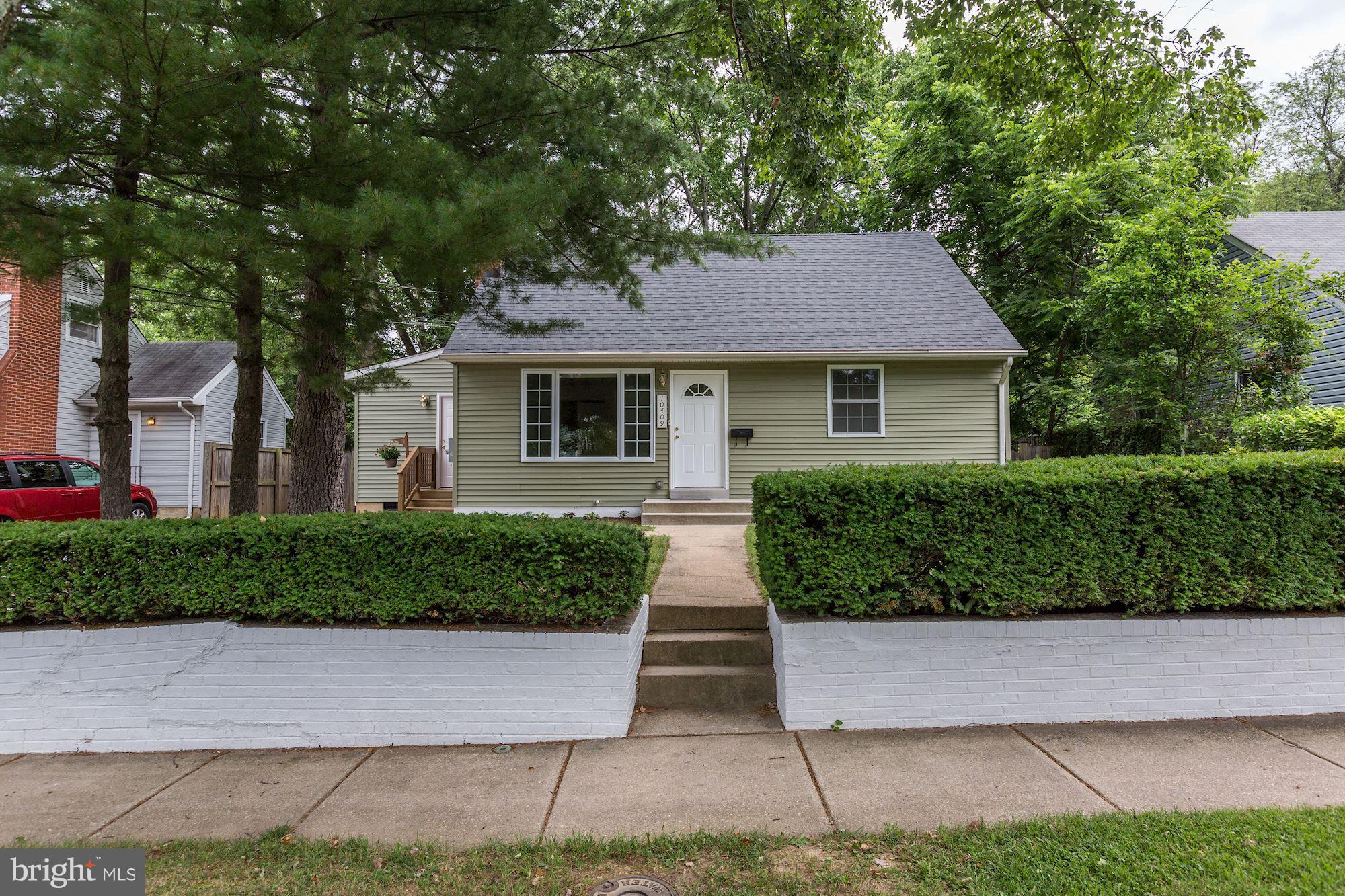 10409 Procter Street Silver Spring, MD 20901 - Photo 2 of 30 a front view of a house with a yard