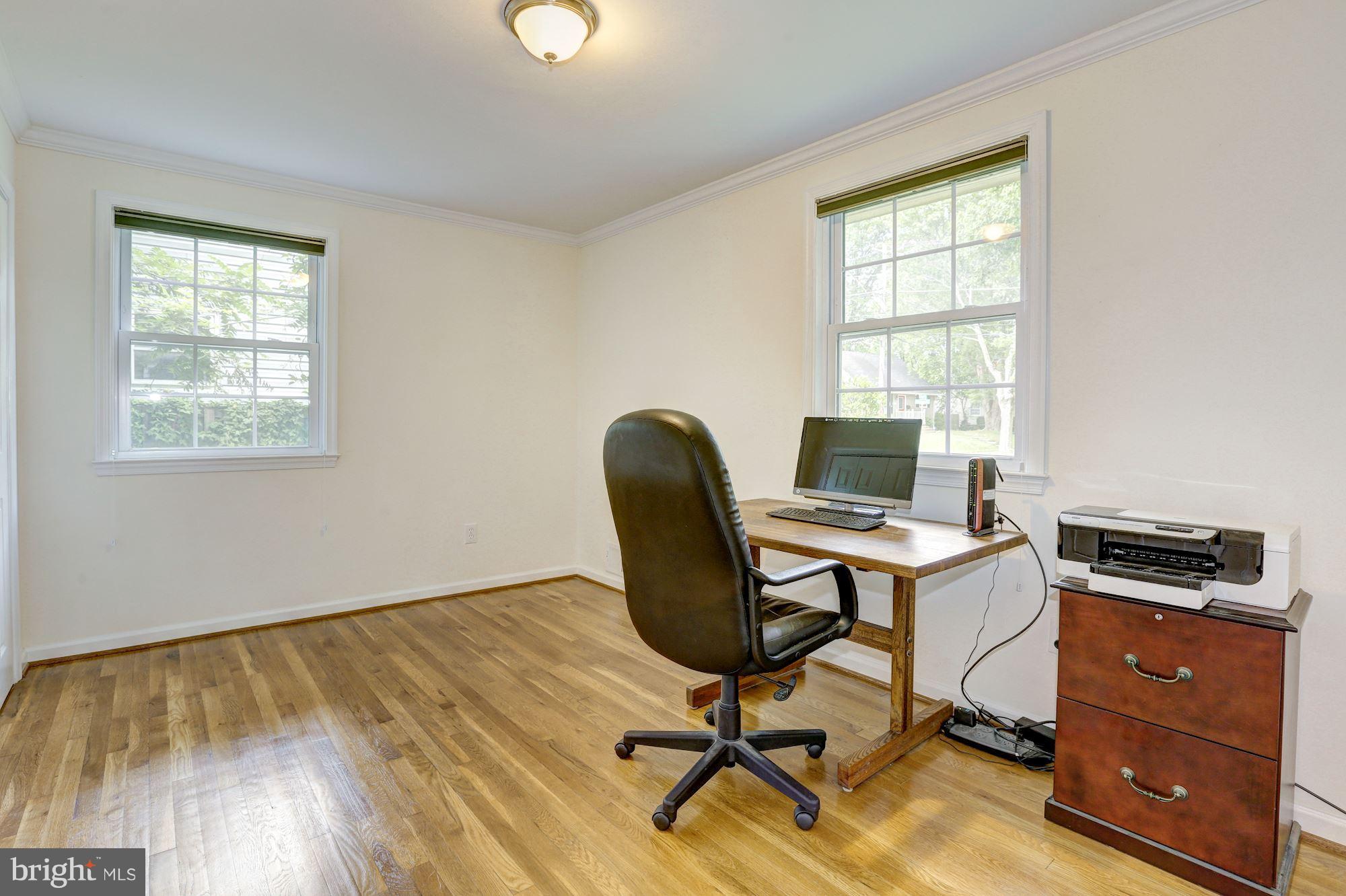 10409 Procter Street Silver Spring, MD 20901 - Photo 15 of 30 a view of a workspace with furniture and a window