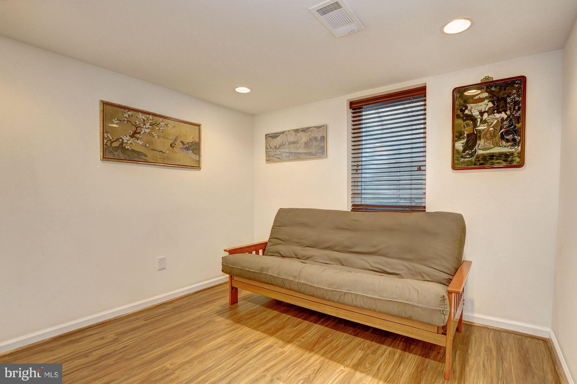 10409 Procter Street Silver Spring, MD 20901 - Photo 24 of 30 a bedroom with a bed and a couch