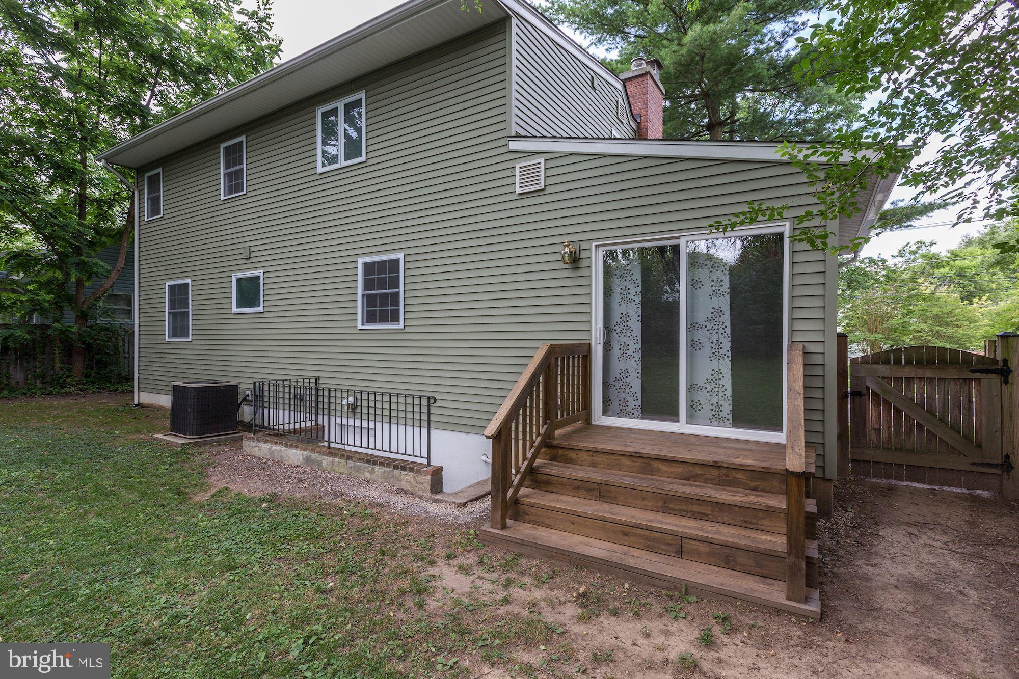 10409 Procter Street Silver Spring, MD 20901 - Photo 29 of 30 a view of a house with backyard and wooden fence