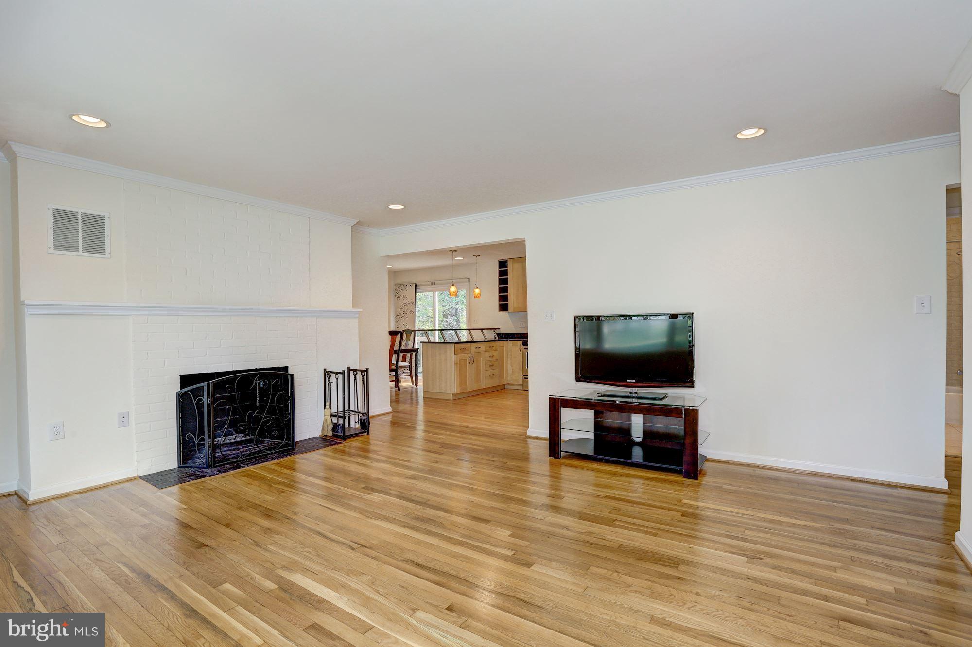 10409 Procter Street Silver Spring, MD 20901 - Photo 5 of 30 a living room with furniture and a fireplace or television