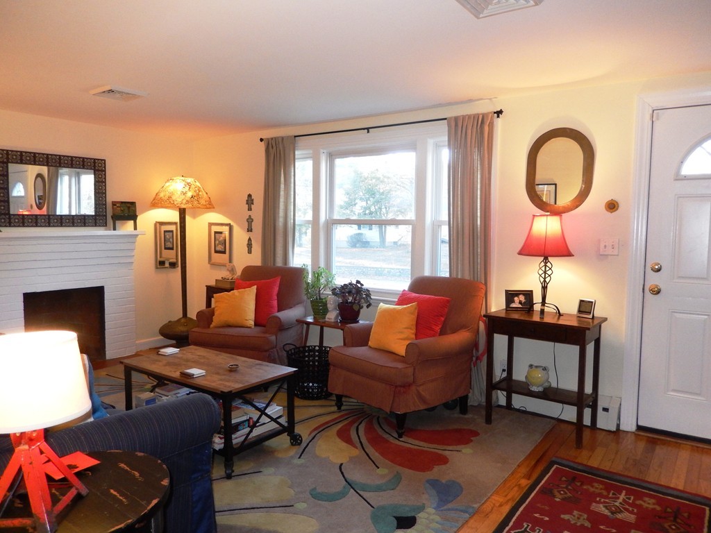 6 James Road Sharon, MA 02067 - Photo 2 of 10 a living room with fireplace furniture and a large window