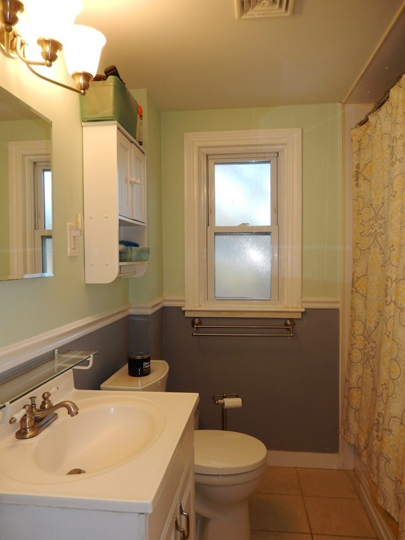 6 James Road Sharon, MA 02067 - Photo 10 of 10 a bathroom with a sink a toilet and mirror