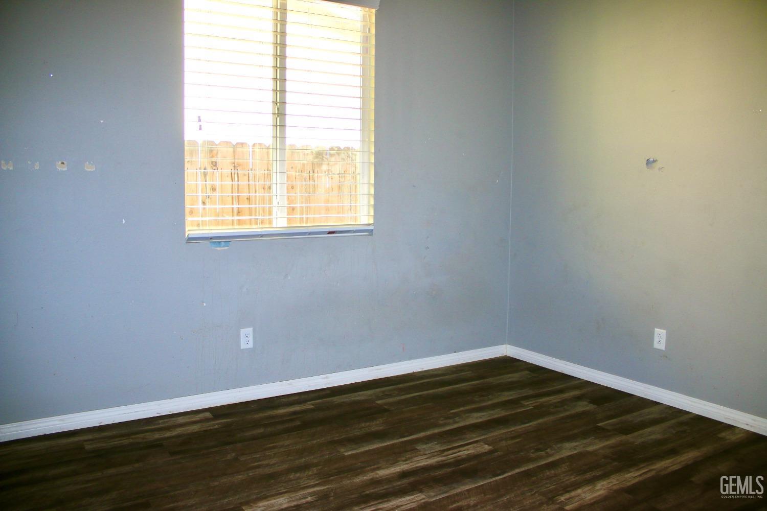 Undisclosed Address Bakersfield, CA 93313 - Photo 14 of 26 a view of a room with wooden floor and a window