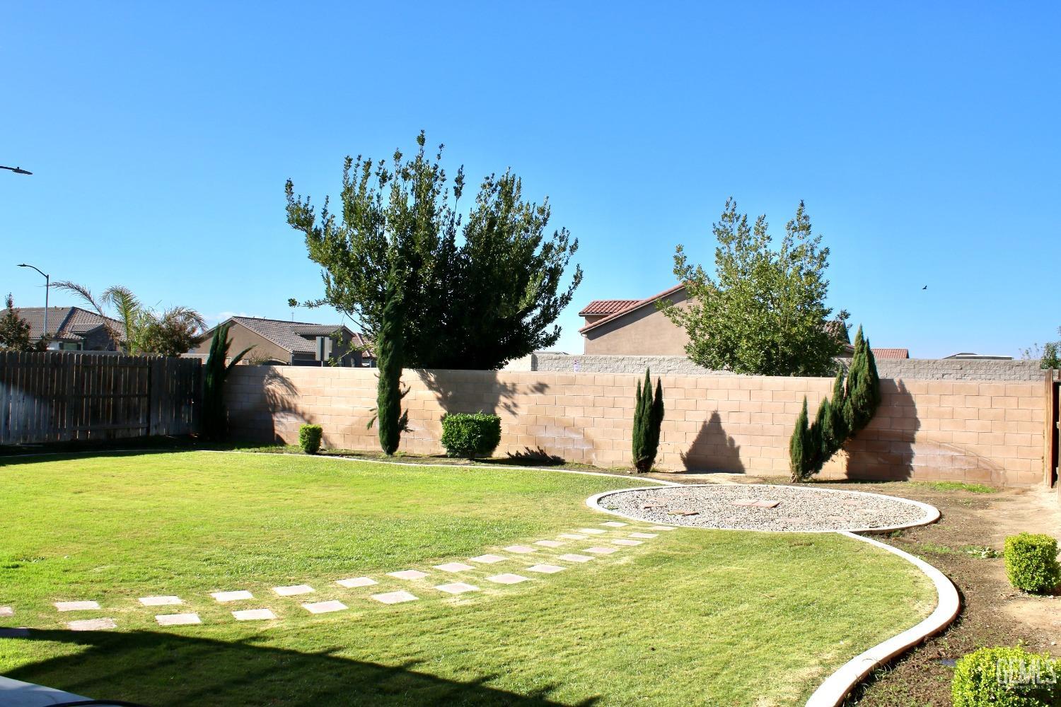 Undisclosed Address Bakersfield, CA 93313 - Photo 20 of 26 a view of swimming pool with a yard