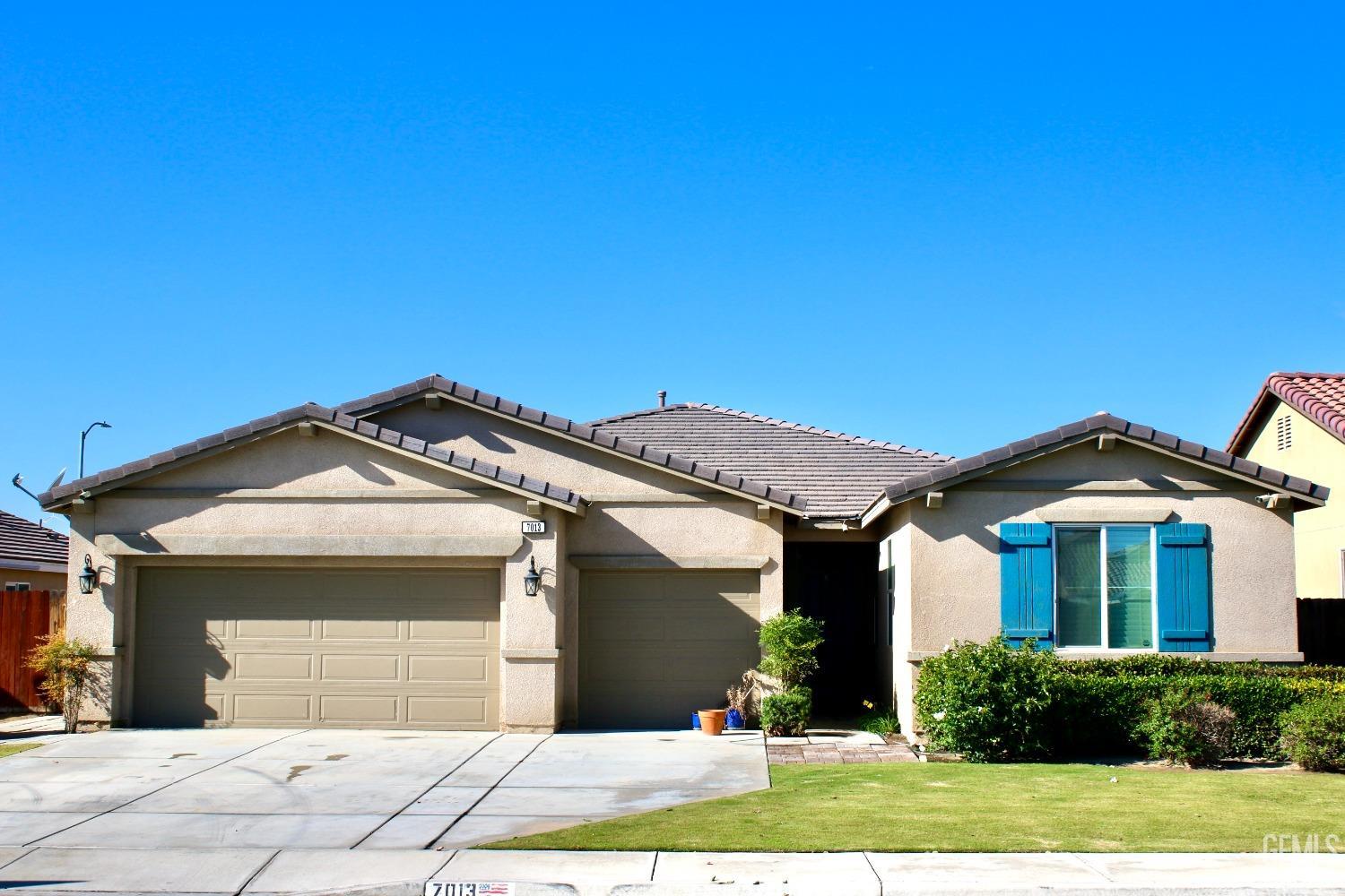 Undisclosed Address Bakersfield, CA 93313 - Photo 2 of 26 a front view of a house with garden