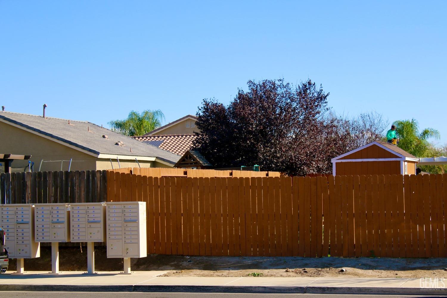 Undisclosed Address Bakersfield, CA 93313 - Photo 26 of 26 a view of a house with wooden fence