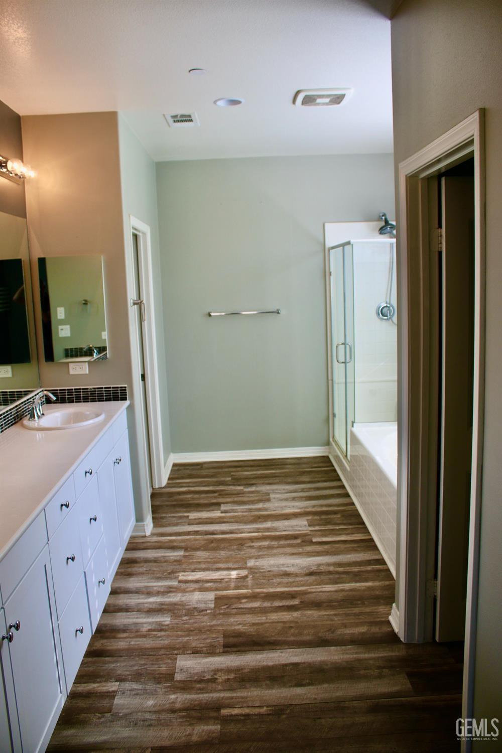 Undisclosed Address Bakersfield, CA 93313 - Photo 10 of 26 a bathroom with a sink and a mirror
