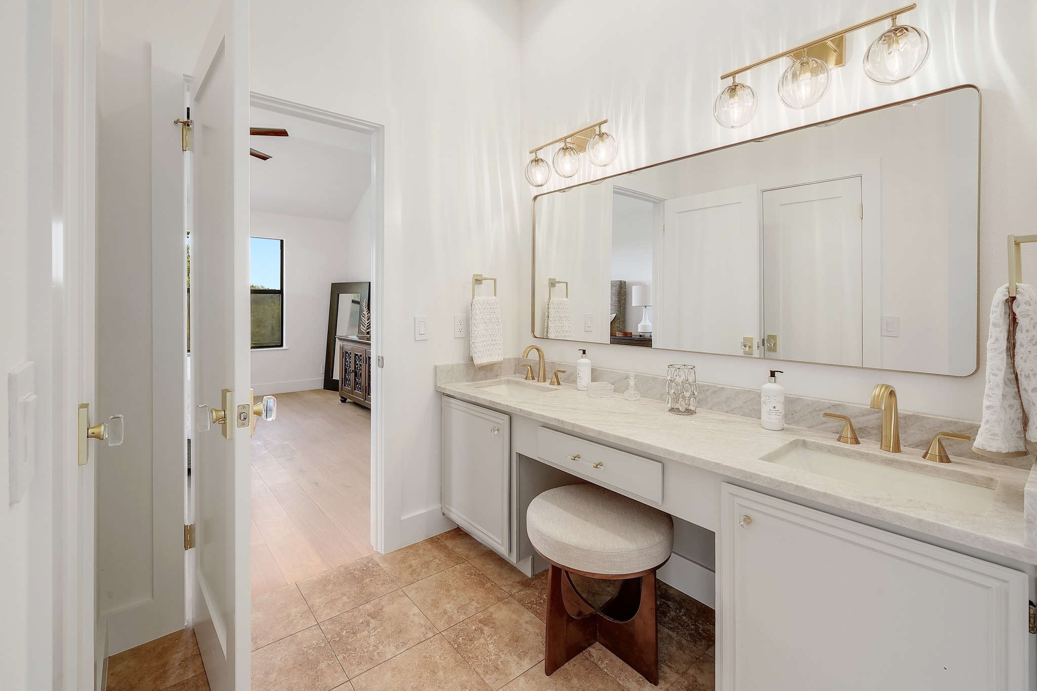 7705 Jester Boulevard Austin, TX 78730 - Photo 15 of 36 Dual vanity and ample counter space enhance this well-appointed bathroom.