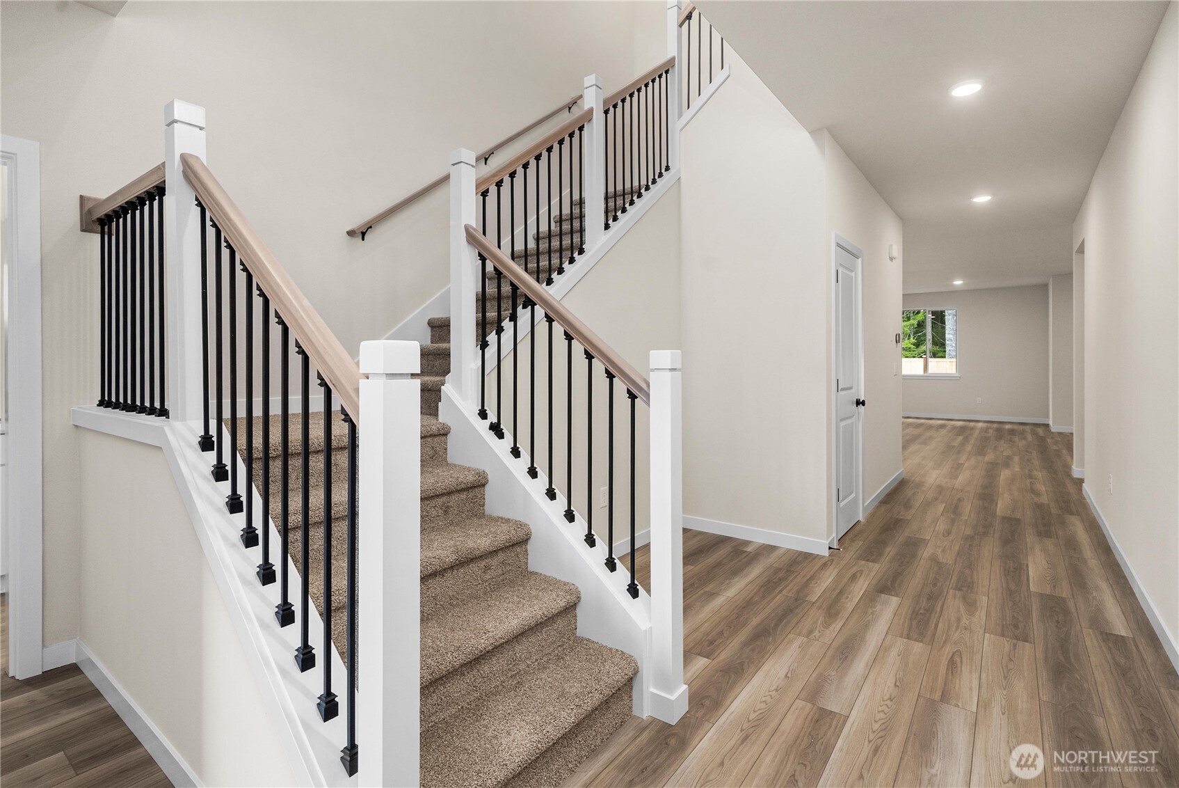 5924 Trce Drive Southwest Port Orchard, WA 98367 - Photo 2 of 25 a view of a hallway with wooden floor and entryway
