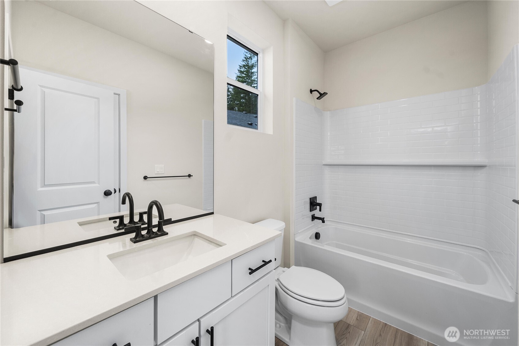 5924 Trce Drive Southwest Port Orchard, WA 98367 - Photo 5 of 25 a bathroom with a sink a toilet and a bathtub