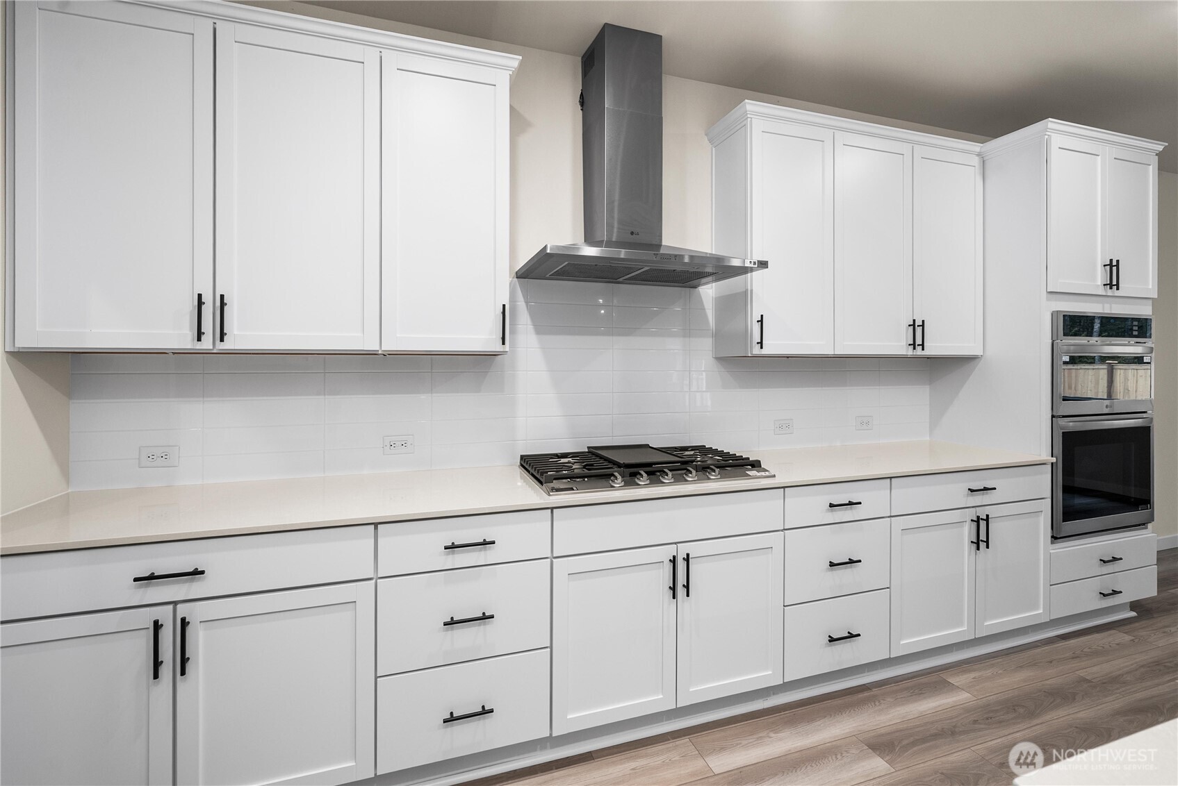 5924 Trce Drive Southwest Port Orchard, WA 98367 - Photo 9 of 25 a kitchen with appliances cabinets and a stove top oven