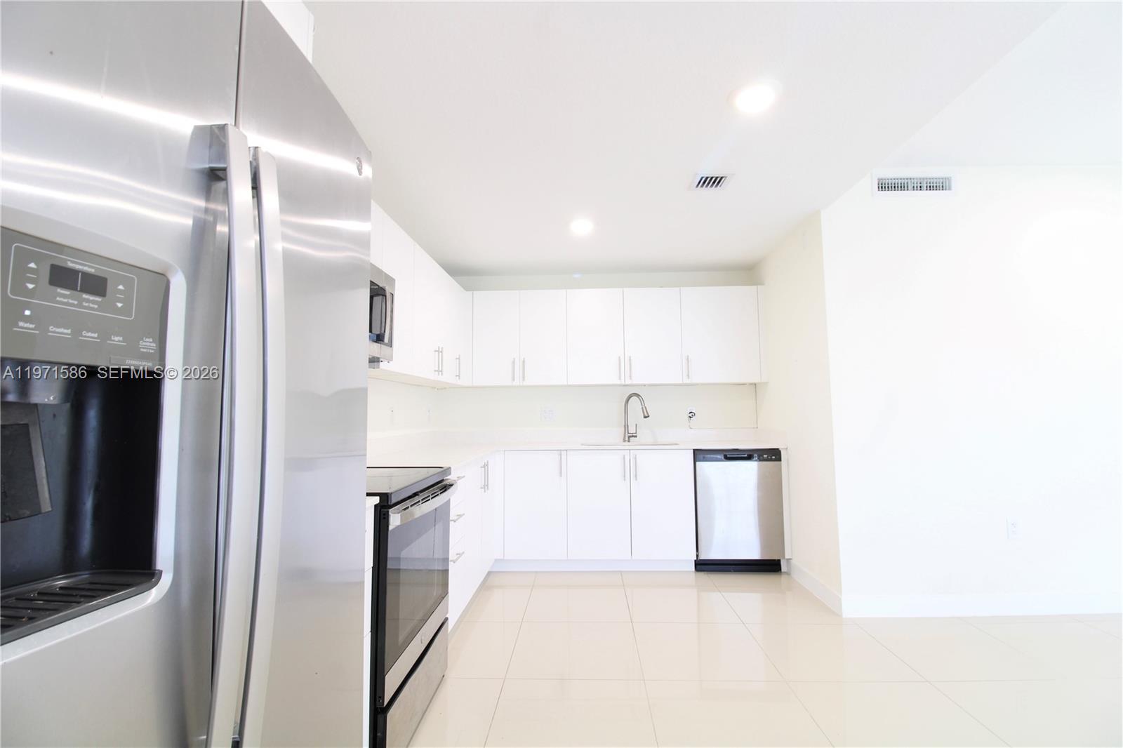 25875 Southwest 145th Avenue Homestead, FL 33032 - Photo 14 of 30 a view of a kitchen with a sink