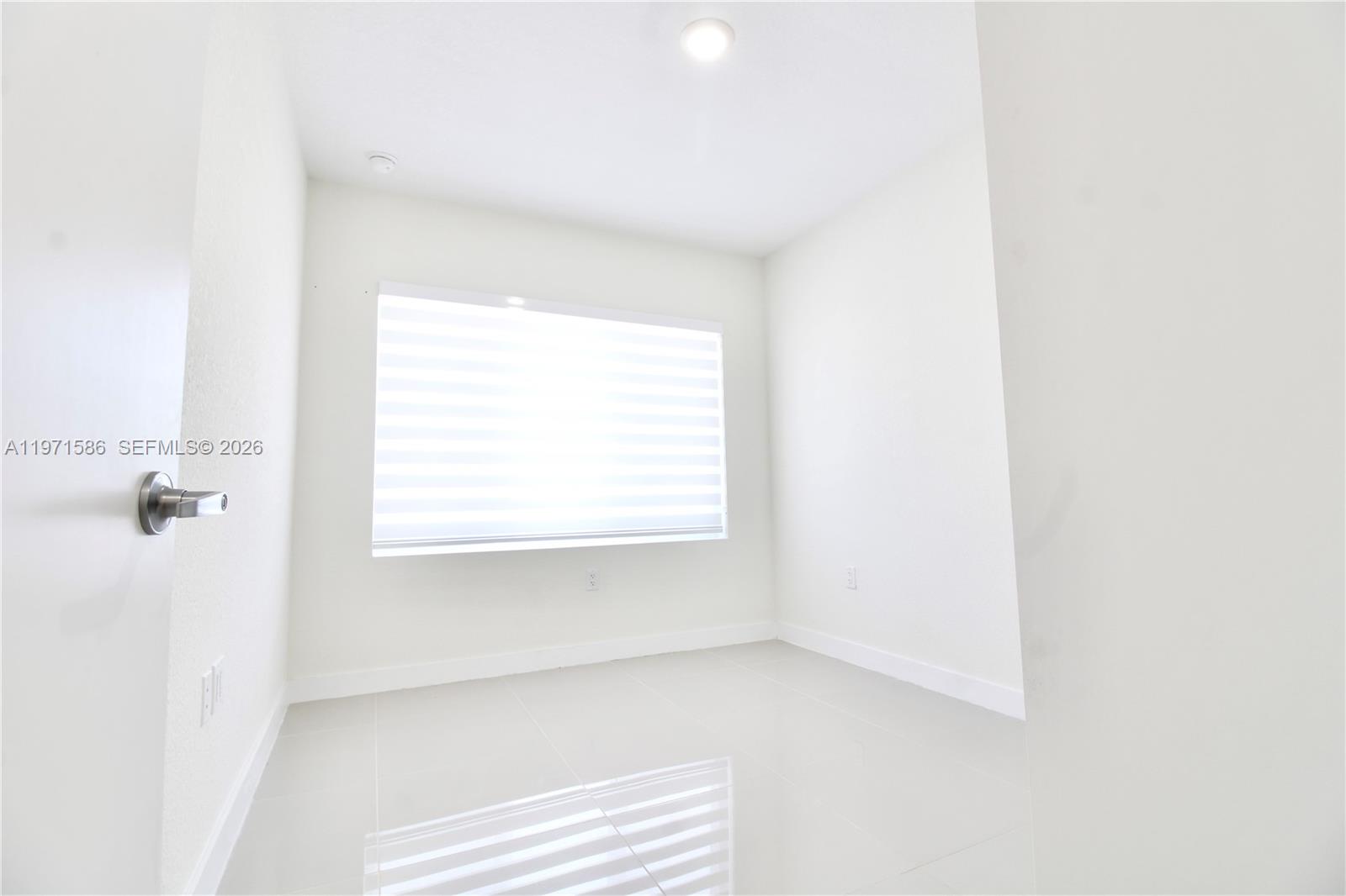 25875 Southwest 145th Avenue Homestead, FL 33032 - Photo 16 of 30 a view of a room that has a window in it