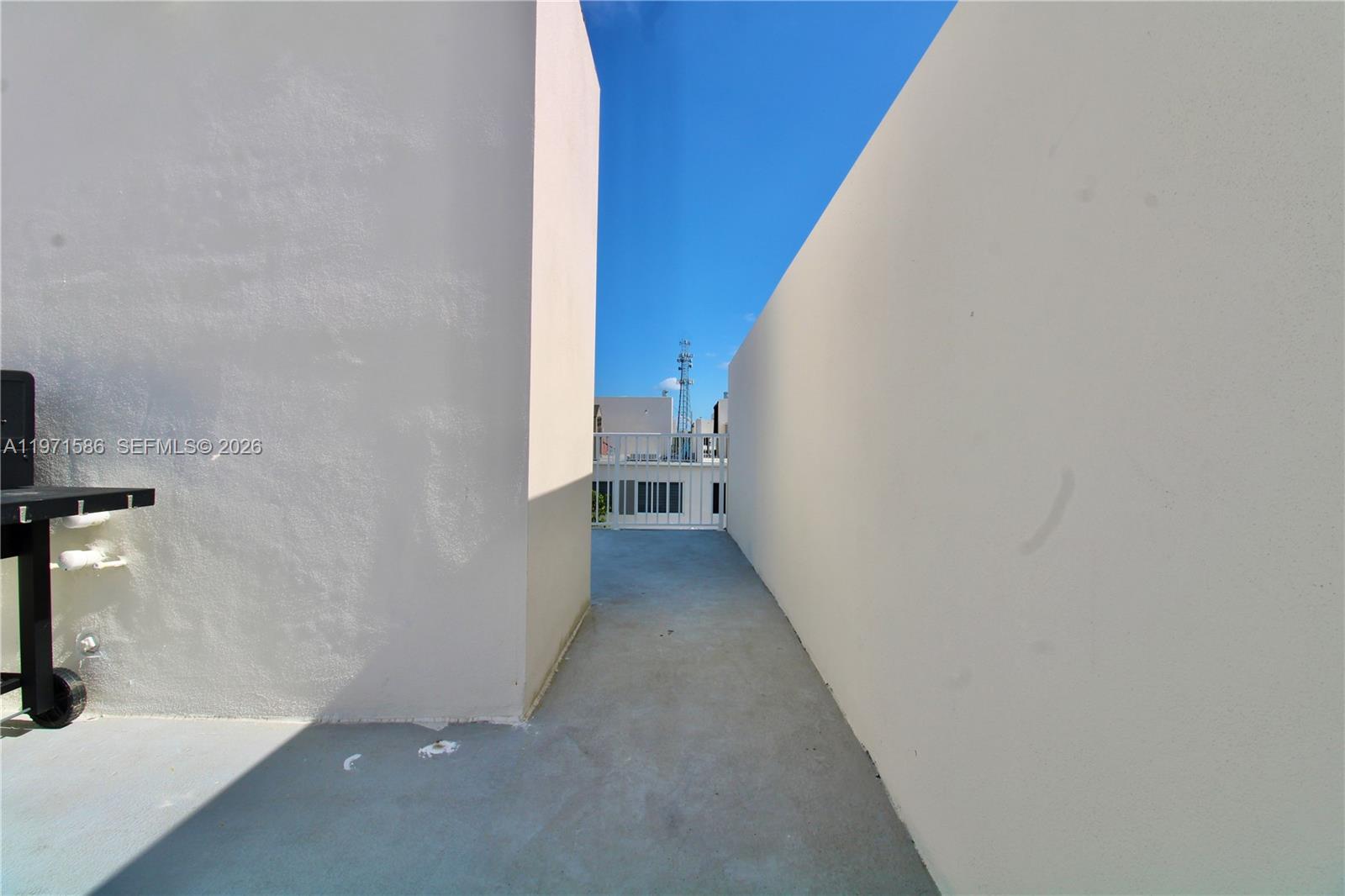 25875 Southwest 145th Avenue Homestead, FL 33032 - Photo 17 of 30 a view of a hallway with wooden floor and staircase