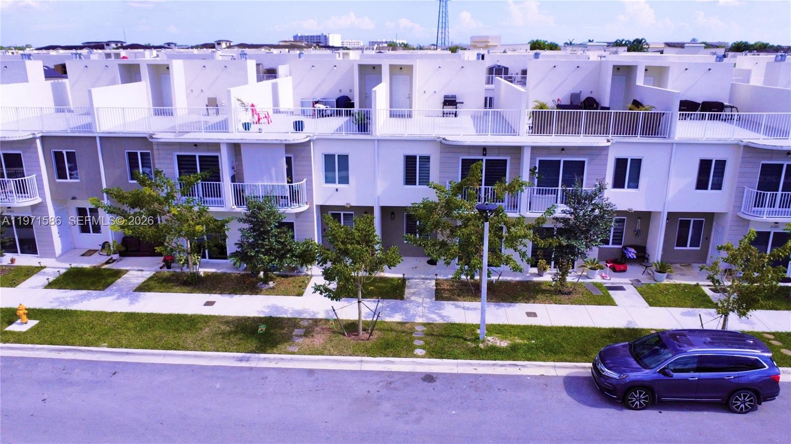 25875 Southwest 145th Avenue Homestead, FL 33032 - Photo 24 of 30 a front view of building with yard