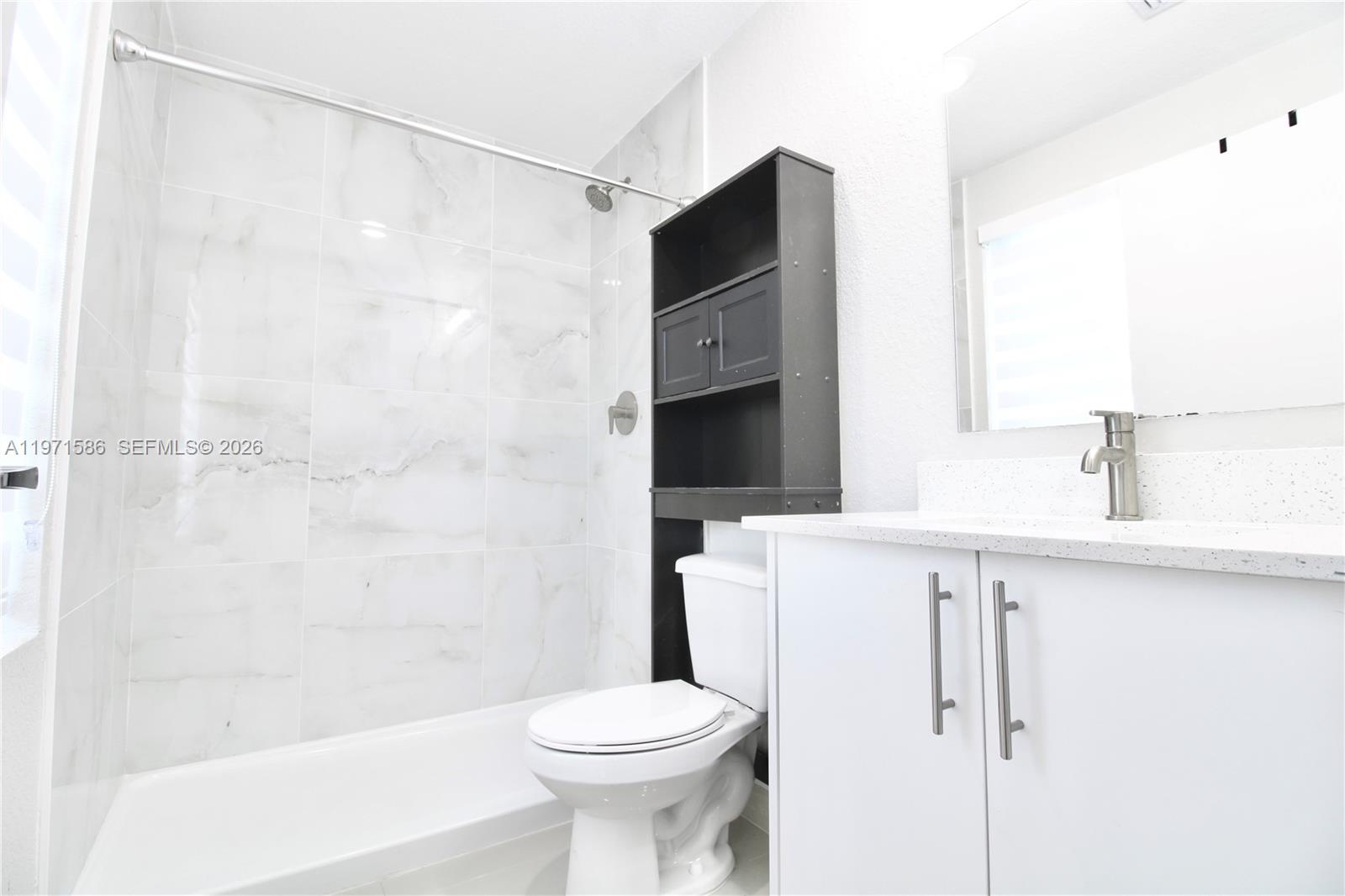 25875 Southwest 145th Avenue Homestead, FL 33032 - Photo 26 of 30 a bathroom with a shower and a toilet