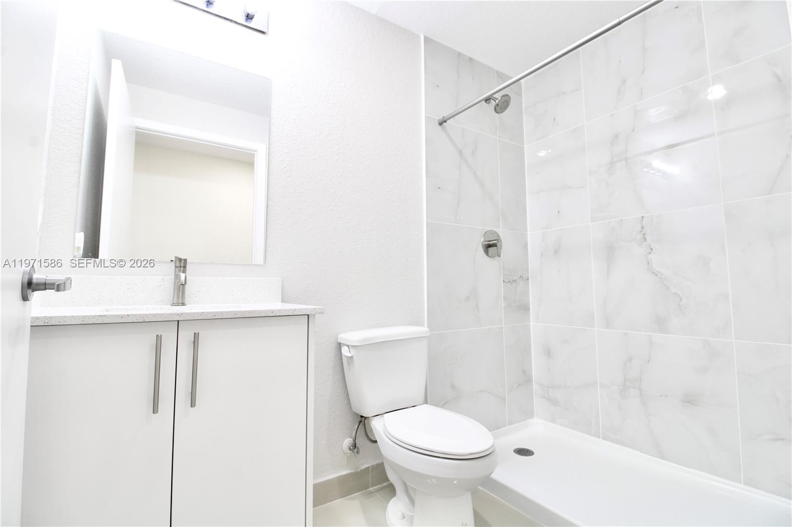 25875 Southwest 145th Avenue Homestead, FL 33032 - Photo 8 of 30 a bathroom with a sink toilet and shower