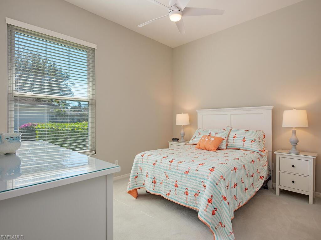 1832 Imperial Golf Course Boulevard Naples, FL 34110 - Photo 11 of 24 Bedroom featuring light colored carpet and a ceiling fan
