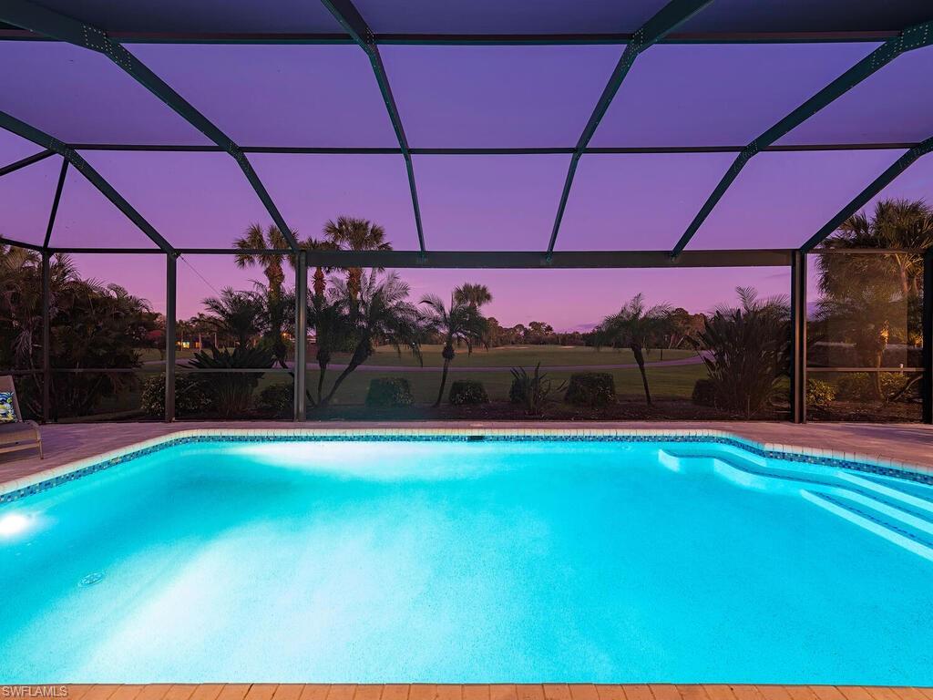 1832 Imperial Golf Course Boulevard Naples, FL 34110 - Photo 18 of 24 Swimming pool with LED lighting and Picture windo screen