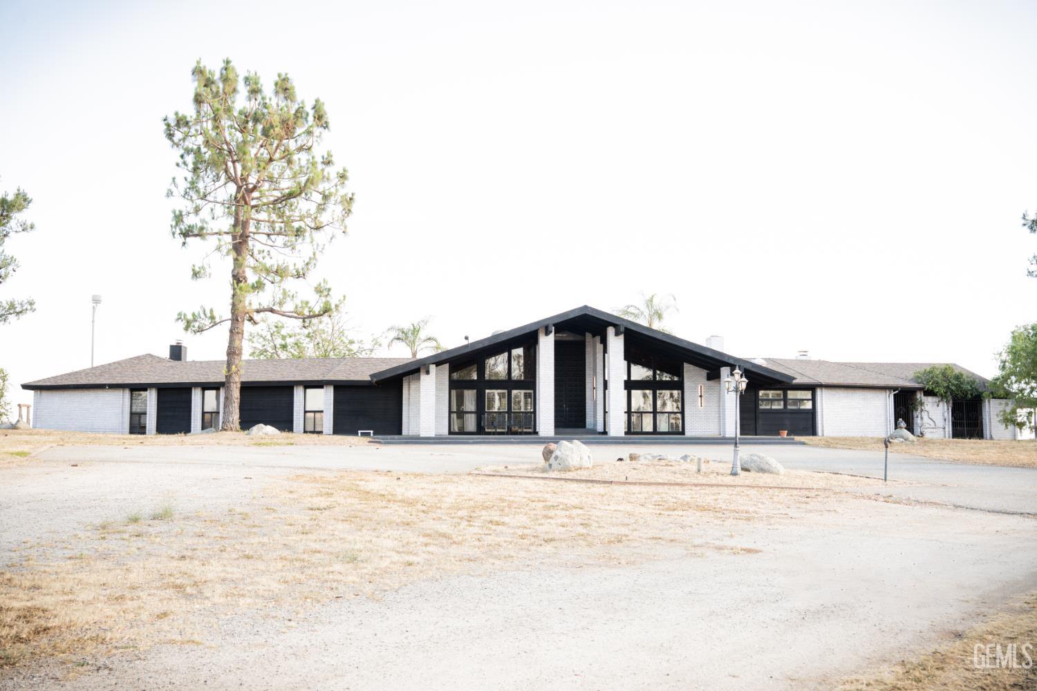 Undisclosed Address Bakersfield, CA 93308 - Photo 1 of 29 a front view of a building with large windows