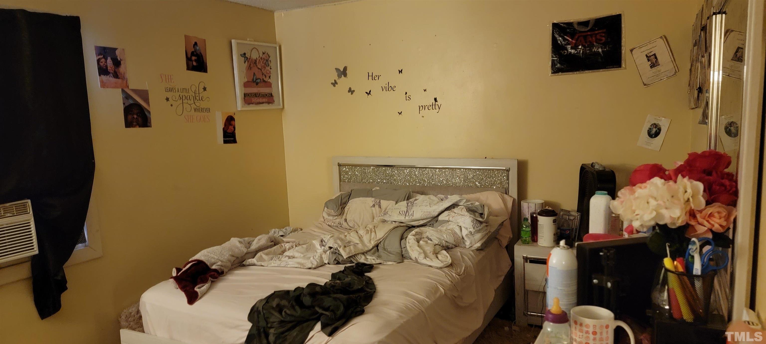 1304 Cherrycrest Drive Durham, NC 27704 - Photo 15 of 18 a bed room with a bed and a couch