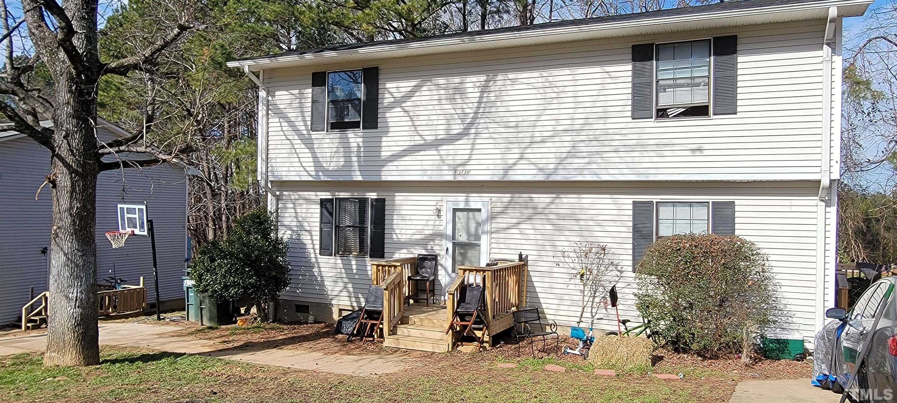 1304 Cherrycrest Drive Durham, NC 27704 - Photo 17 of 18 a front view of a house with garage