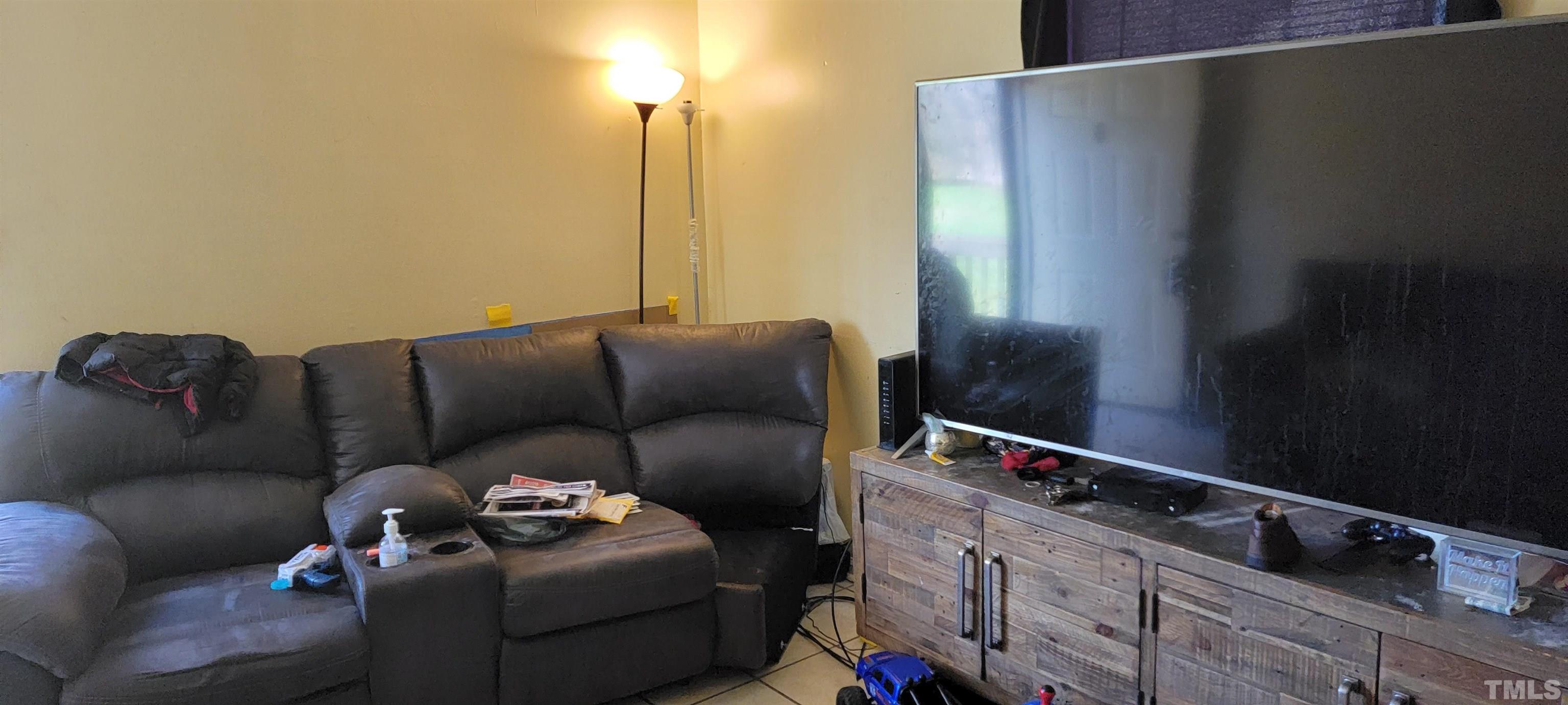 1304 Cherrycrest Drive Durham, NC 27704 - Photo 7 of 18 a living room with furniture and a window