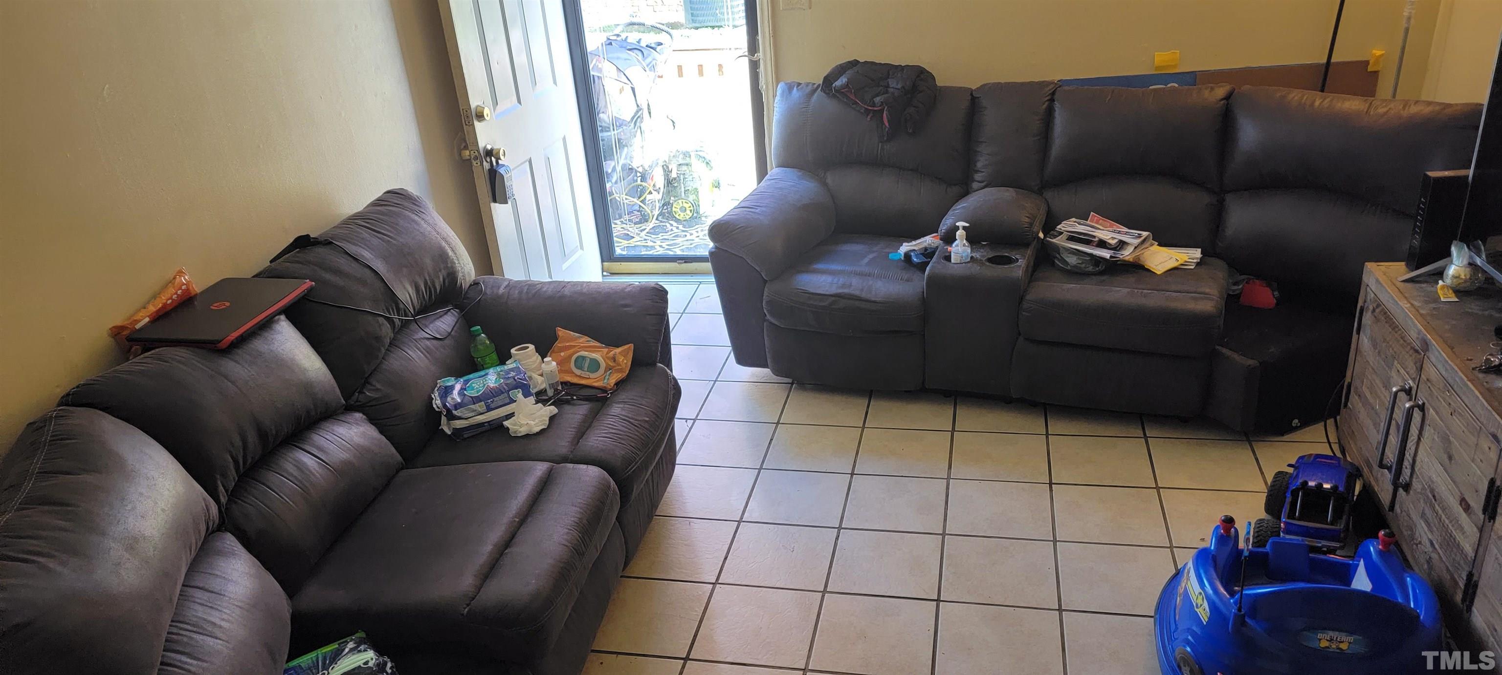 1304 Cherrycrest Drive Durham, NC 27704 - Photo 8 of 18 a living room with furniture and a couch