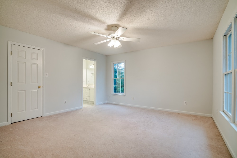 4410 Rhew Drive Durham, NC 27704 - Photo 10 of 13 Features Walk-in closet and nice bathroom. New lighting and floors! Spacious master bedroom