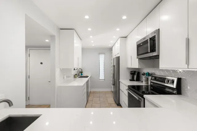 a kitchen with a stove and a microwave