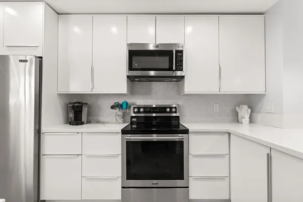 a kitchen with a sink and cabinets