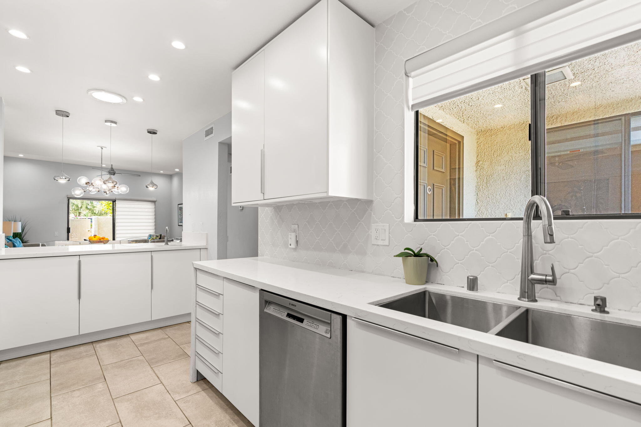 877 East Arenas Road Palm Springs, CA 92262 - Photo 14 of 43 a kitchen with a sink and cabinets
