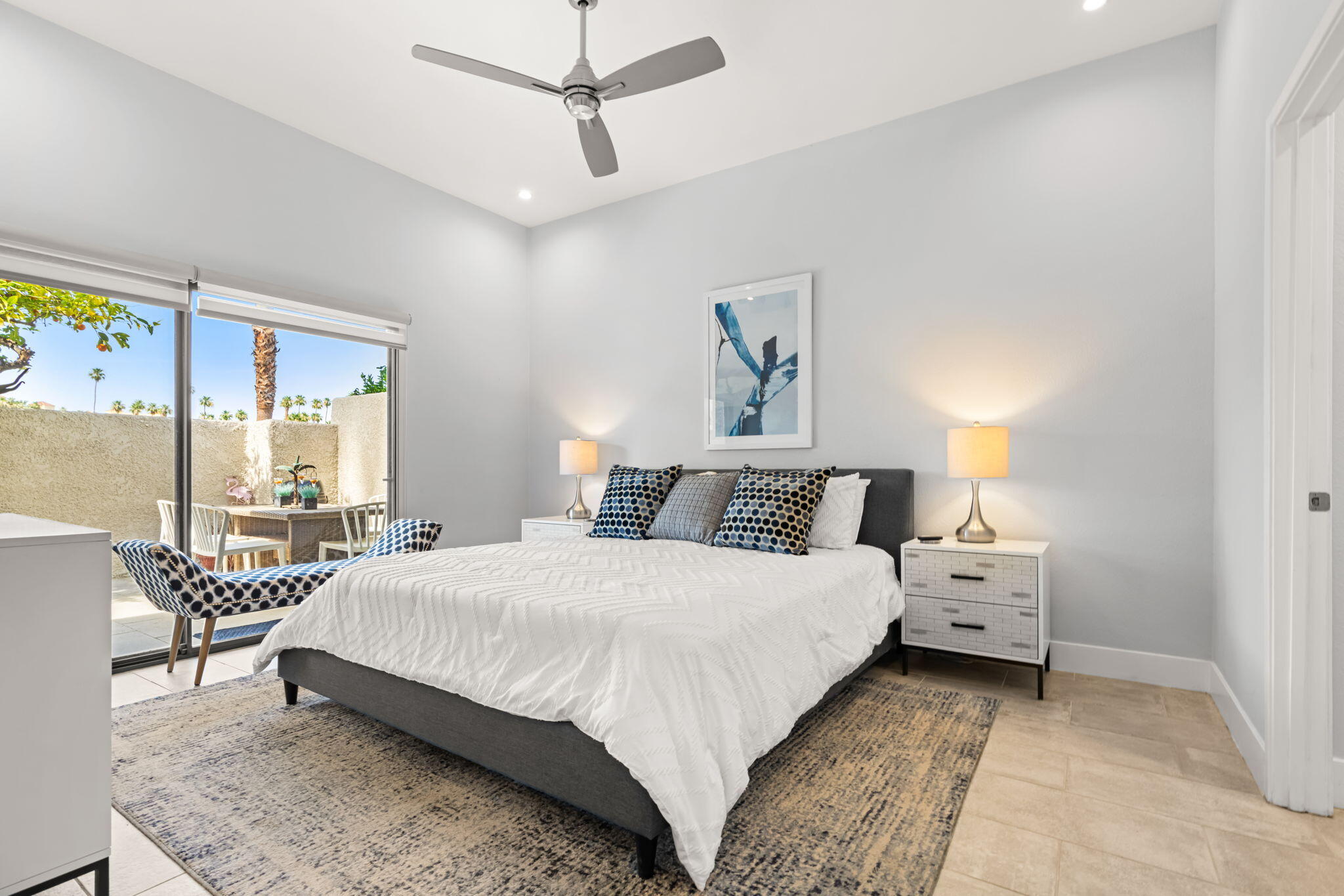 877 East Arenas Road Palm Springs, CA 92262 - Photo 18 of 43 a bedroom with a bed and a chandelier