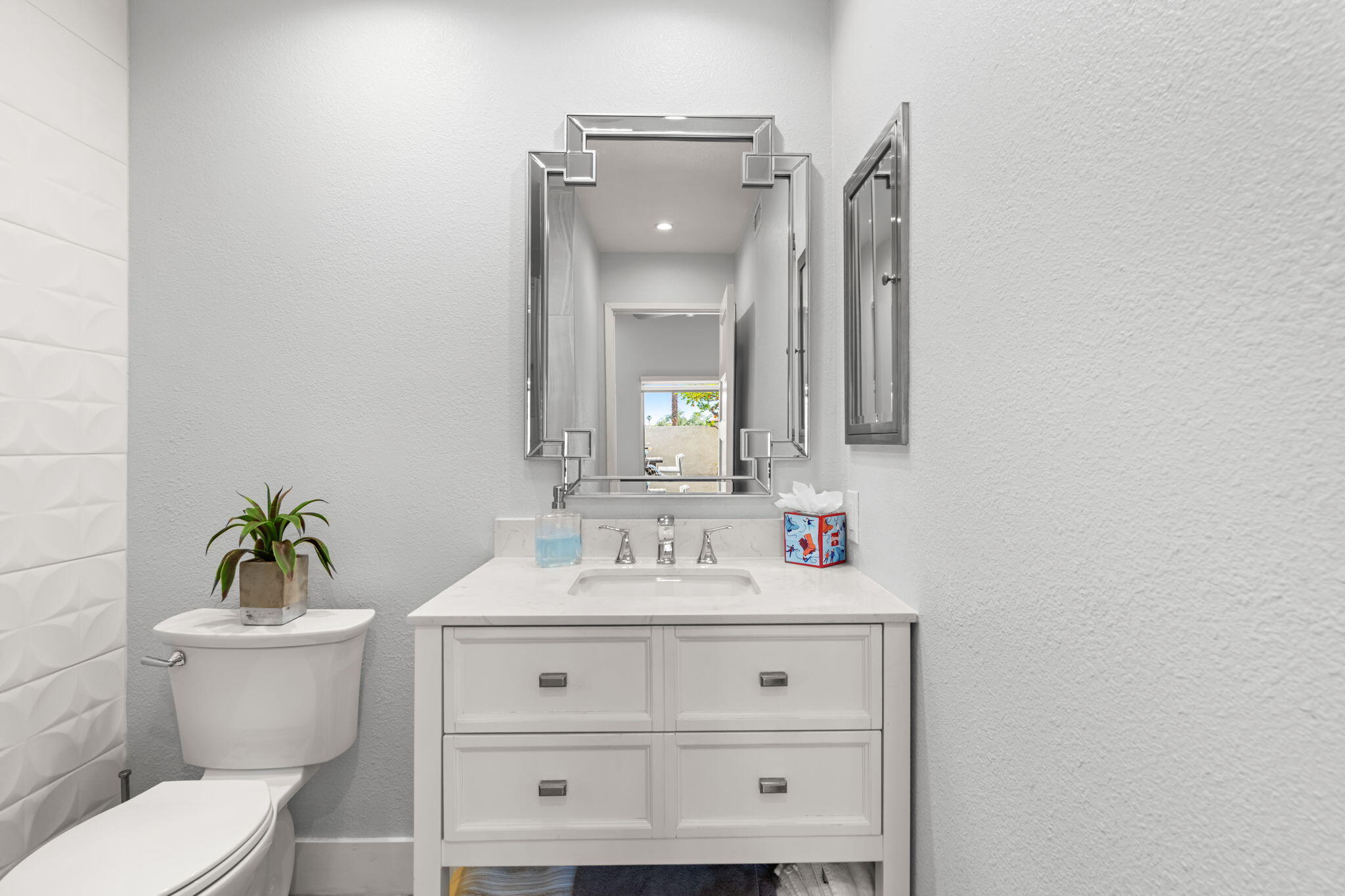 877 East Arenas Road Palm Springs, CA 92262 - Photo 21 of 43 a bathroom with a toilet sink and mirror