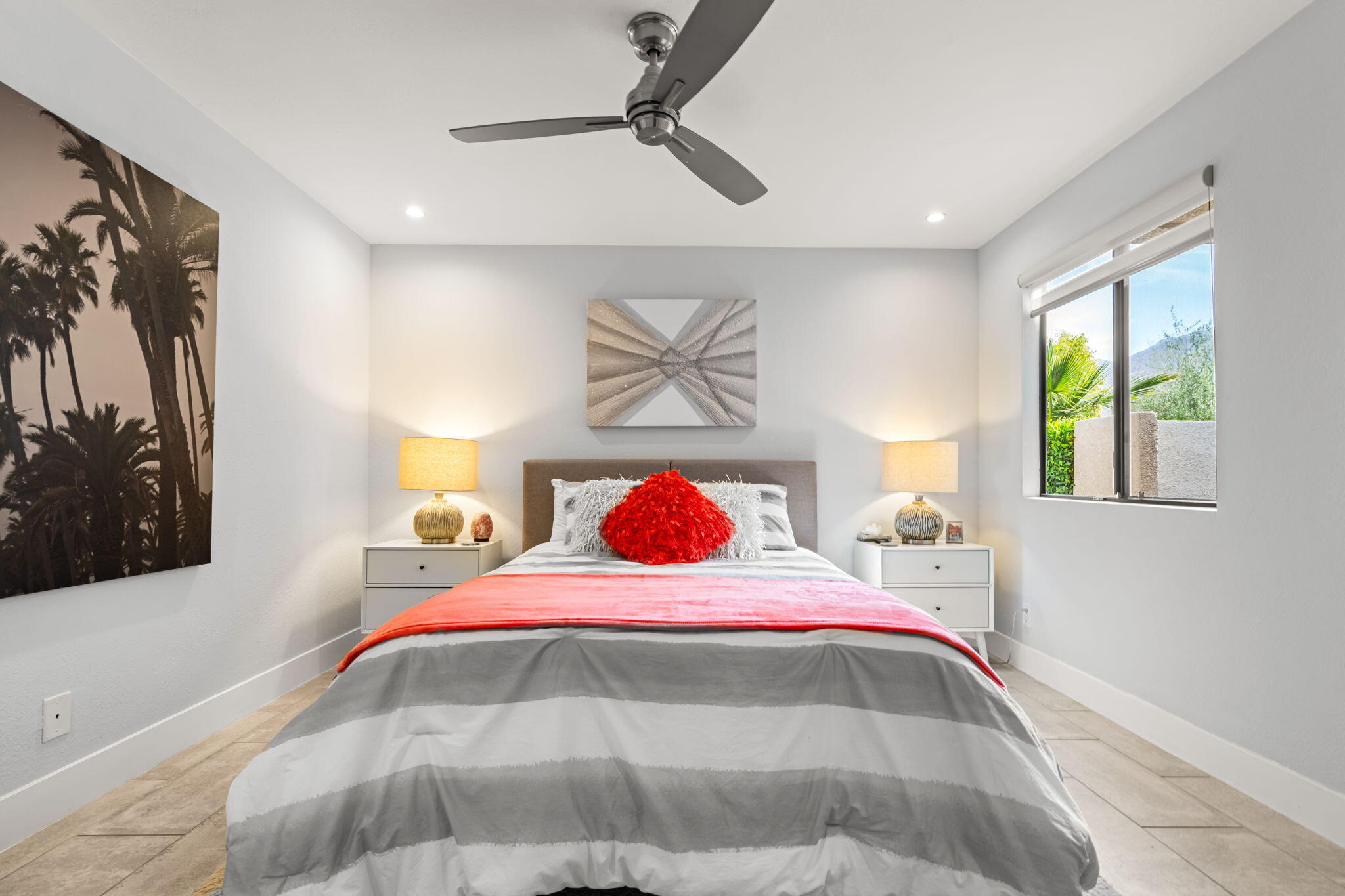 877 East Arenas Road Palm Springs, CA 92262 - Photo 26 of 43 a bedroom with a bed and a painting on the wall