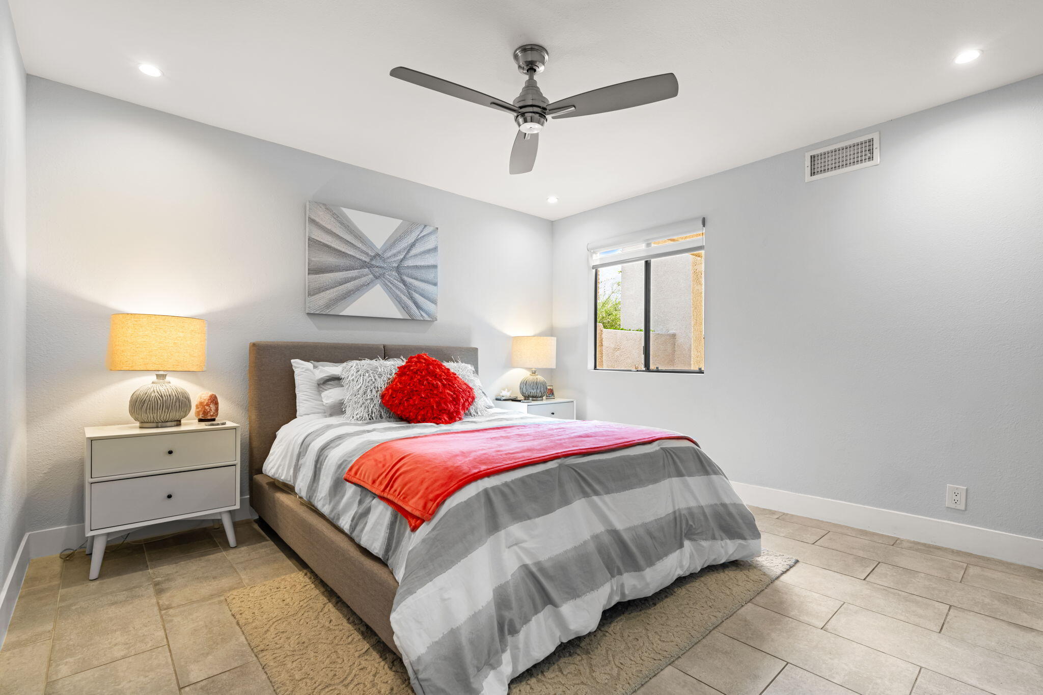 877 East Arenas Road Palm Springs, CA 92262 - Photo 27 of 43 a bedroom with a bed and a chandelier