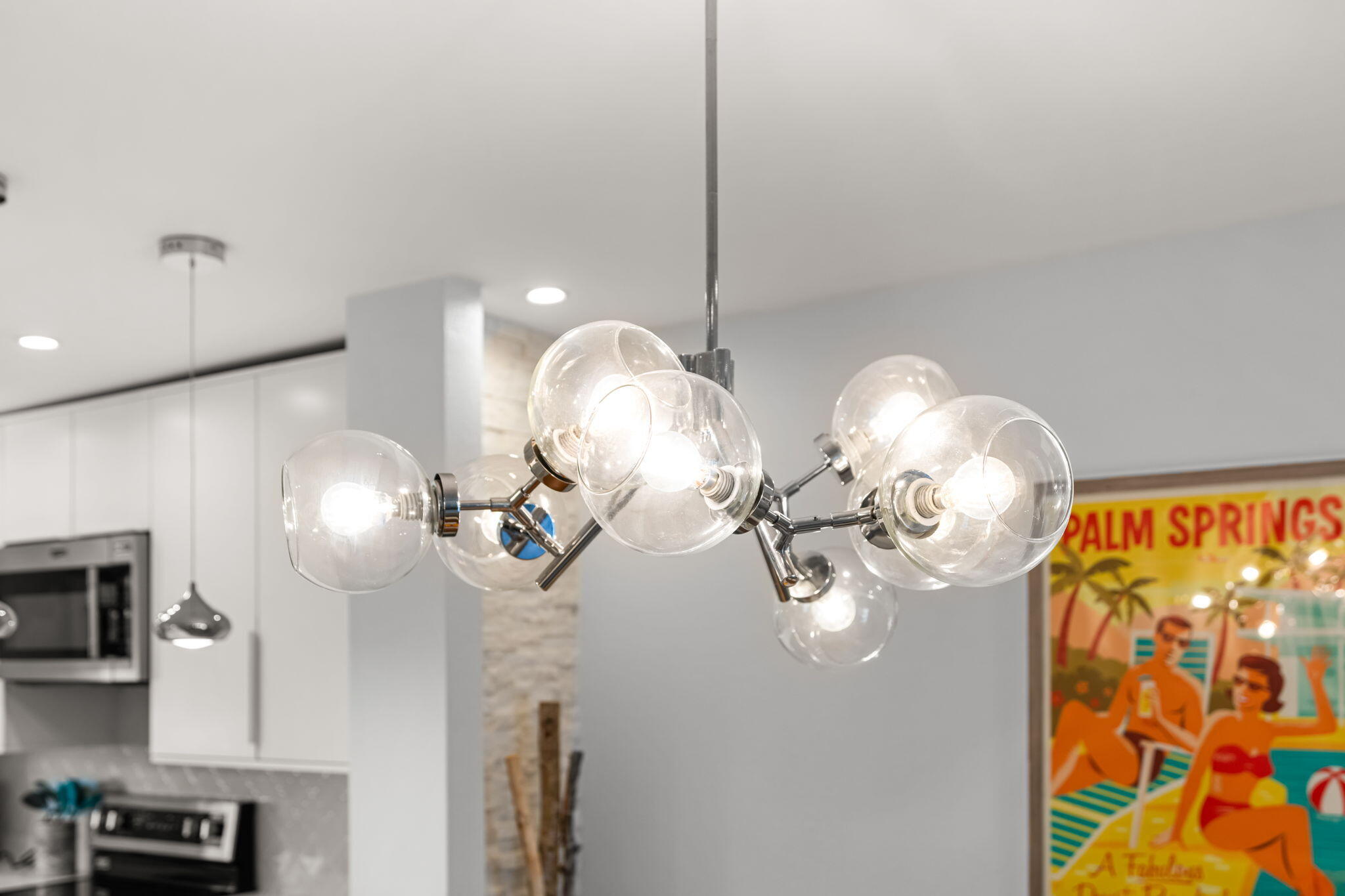 877 East Arenas Road Palm Springs, CA 92262 - Photo 32 of 43 a view of a chandelier fan and kitchen view
