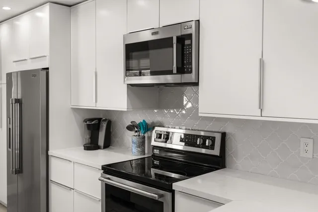 a bedroom with a bed and a night stand