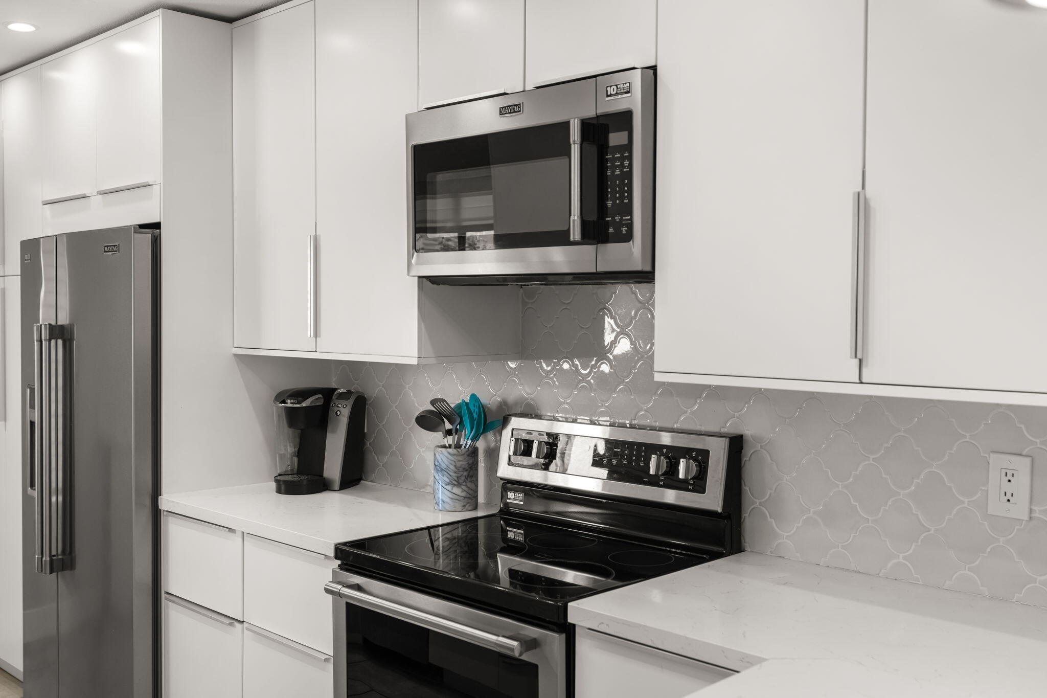 877 East Arenas Road Palm Springs, CA 92262 - Photo 34 of 43 a kitchen with stainless steel appliances a stove and a microwave